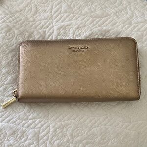 Kate Spade large gold metallic zip around wallet w/ cranberry and pink interior